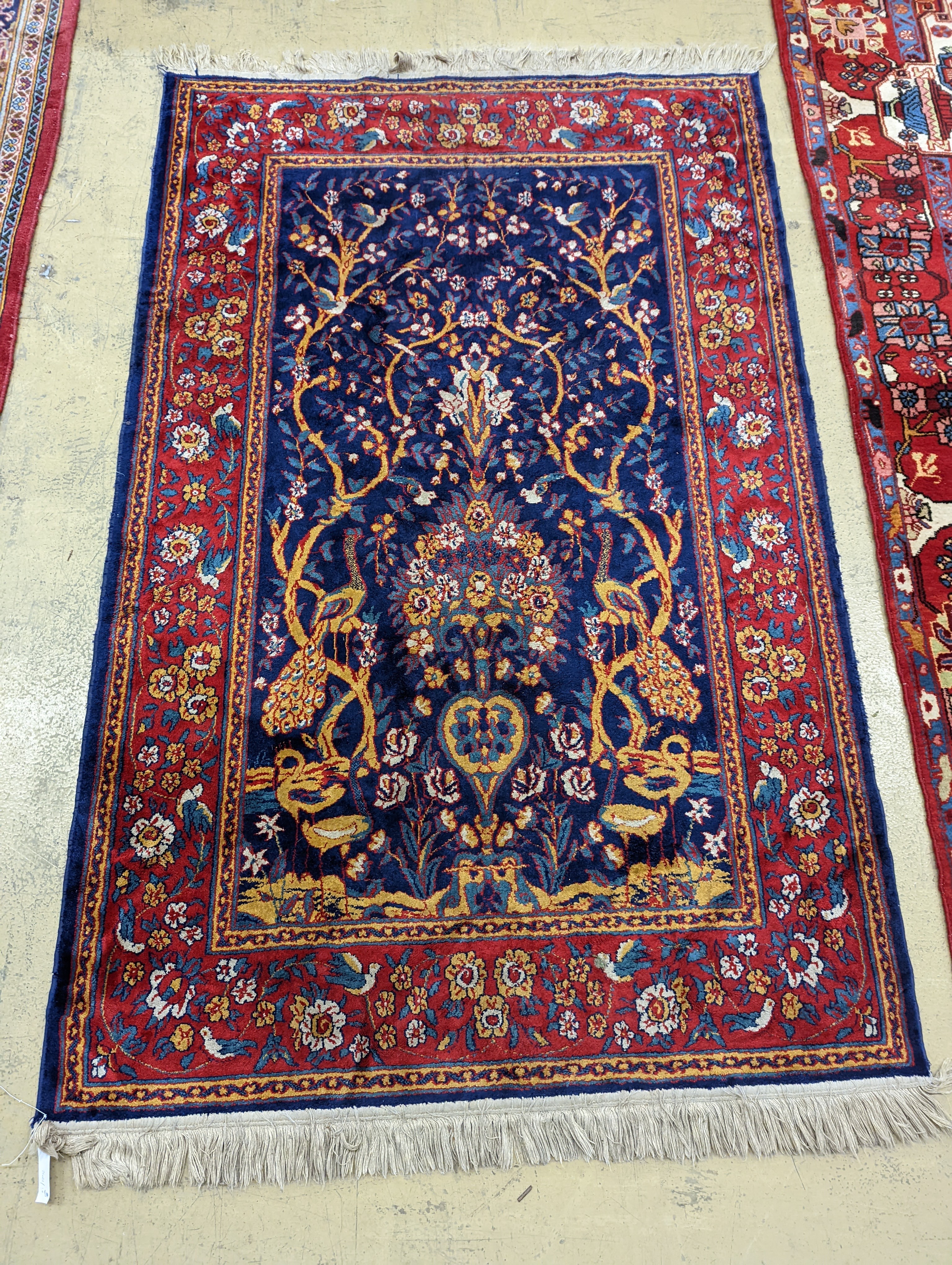 A Caucasian design ivory ground carpet, 260 x 158cm together with a smaller Tabriz style Tree of Life rug